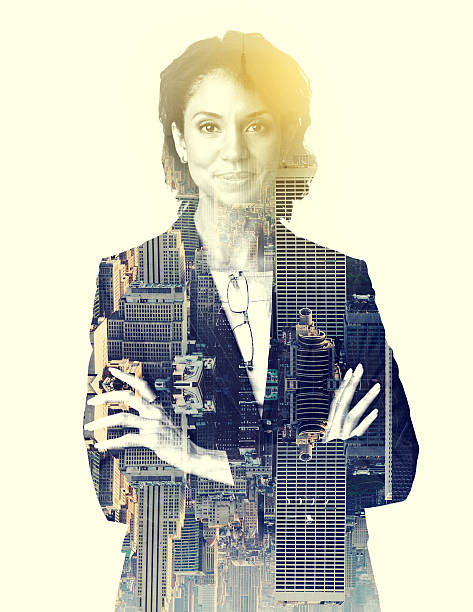 Multiple exposure shot of a corporate businesswoman superimposed over a city