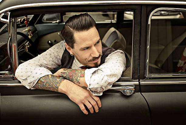 istock Retro man sitting int his car 515515261