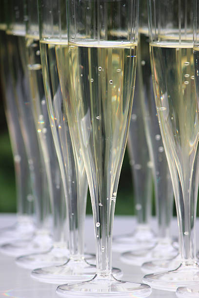 istock Plastic champagne flutes image / sparkling wine glasses at wedding reception 515515415