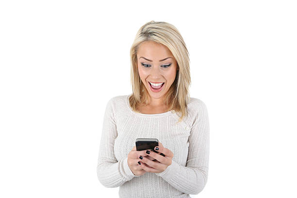 istock girl smiling at phone 515515611