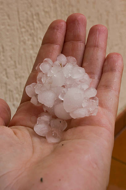 istock After the hailstorm. Hailstone in hand 515518077