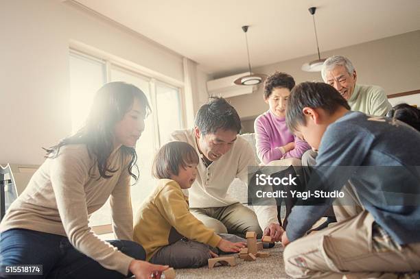 Family Playing Together At Home Stockfoto en meer beelden van Familie - Familie, Familie met meerdere generaties, Aziatische en Indiase etniciteit