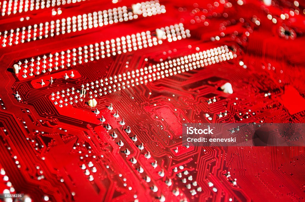 Red Motherboard Closeup of a red printed circuit board Abstract Stock Photo