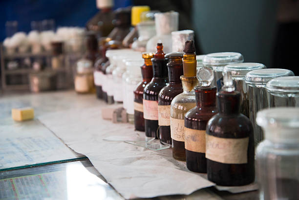istock Old and Mismatched Pharmacy Bottles Filled with Medicine 515518292