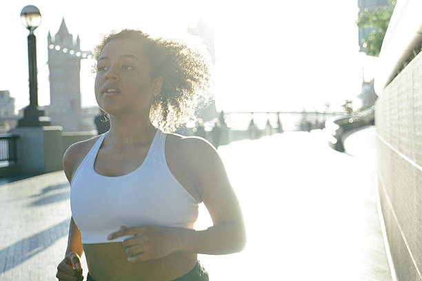 istock Cheerful Woman Running Outdoors In The Early Morning 515519526