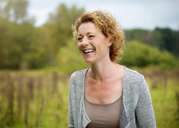 istock Smiling middle aged woman outdoors 515521103
