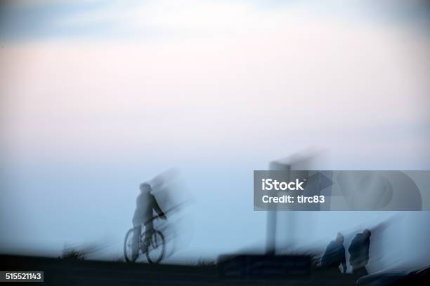 Motion Blur Of Cyclists And Walkers At Dusk Stock Photo - Download Image Now - Blue, Blurred Motion, Color Image