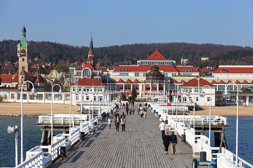 Sopot, Poland - April 26, 2012: The Sopot Pier in the city of Sopot, built as a pleasure pier and as a mooring point for cruise boats, first opened in 1827. At 511.5m, the pier is the longest wooden pier in Europe.