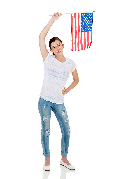 istock girl holding american flag 515524574