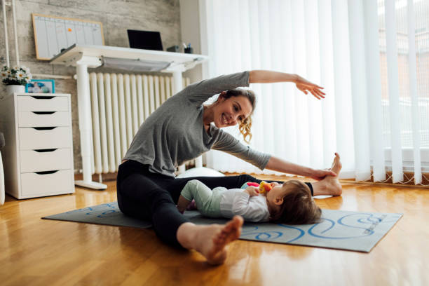 istock Mother Exercise With Her Baby At Home 515524870