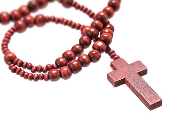 istock rosary beads with cross from red wood isolated on white 515526398