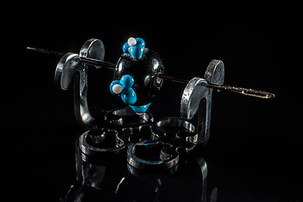 istock Black and blue glass bead on stand 515531966