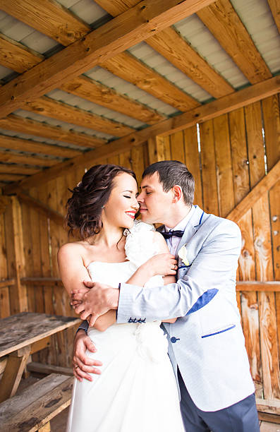 istock wedding pair hugging and kissing 515533024