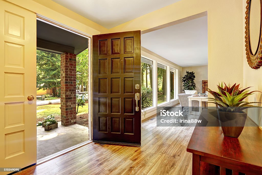 Entrance hallway with open door Entrance hallway with cabinet. View of entrance porch through open door Apartment Stock Photo