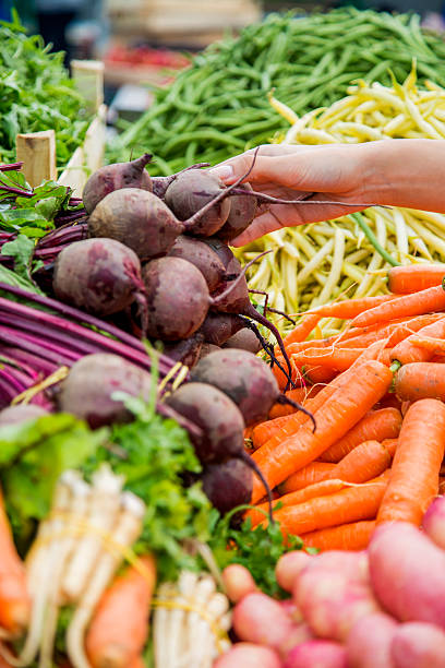 Woman buying vegetables on the market