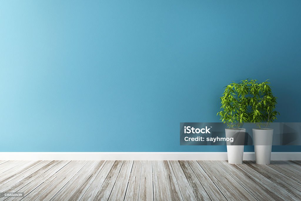 white flower plot and blue wall interior Blue Stock Photo