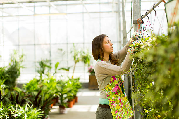 istock Young woman in flower garden 515551069