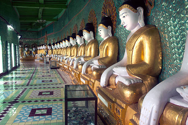 istock Row of Buddhas in U Min Thonze cave ,Myanmar. 515551987