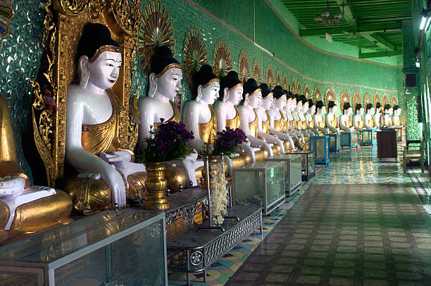 istock Row of Buddhas in U Min Thonze cave ,Myanmar. 515551991