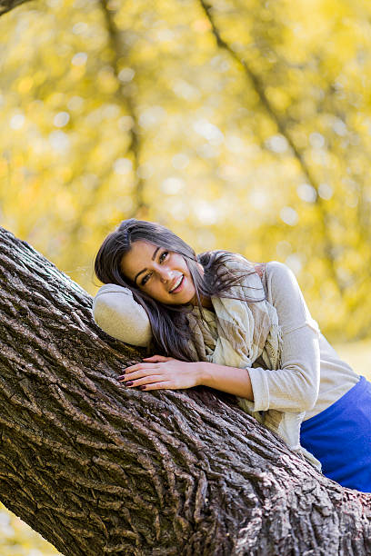 istock Young woman in autumn forest 515552847