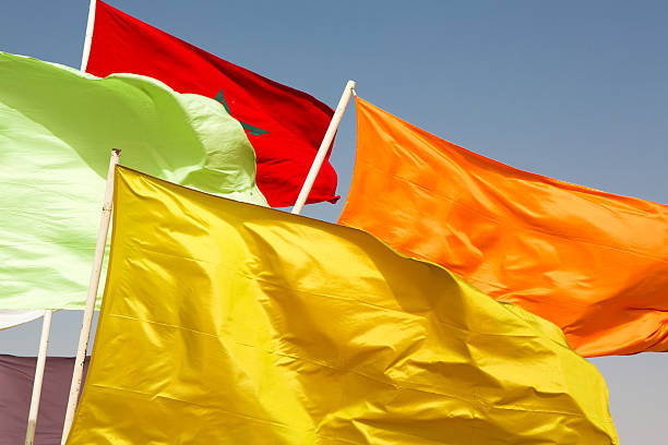 istock Flags of Morocco waving against blue sky 515553373