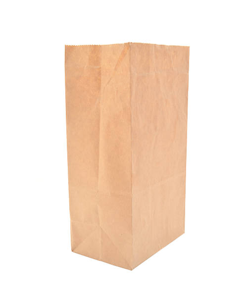 istock Brown paper bag isolated on white 515581077