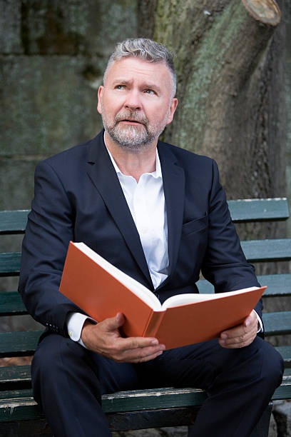 istock businessman sitting on a bench 515581301