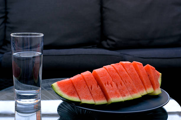 Watermelon and a glass of water stock photo