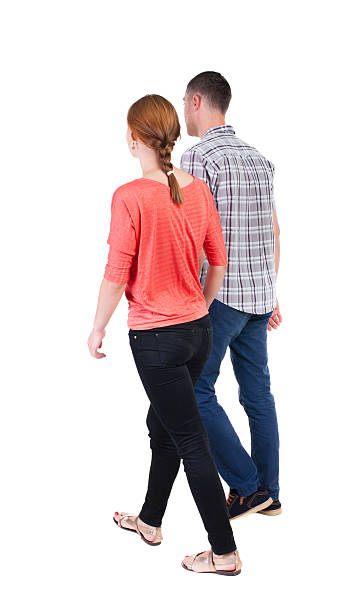 Back view going couple. Back view going couple. walking friendly girl and guy holding hands. Rear view people collection. backside view of person. Isolated over white background. pics of girls buttocks stock pictures, royalty-free photos & images