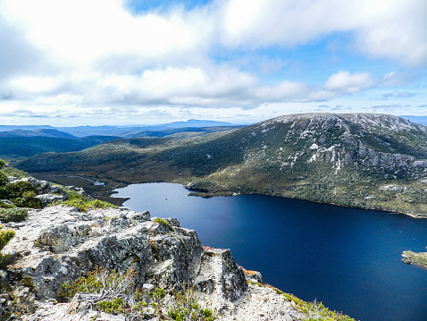 Cradle mountain lake with a high up view with a blue sky