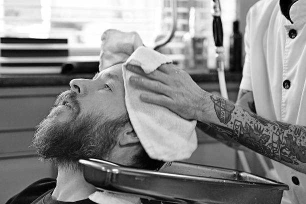 istock barber working with customer at barbershop 515583029