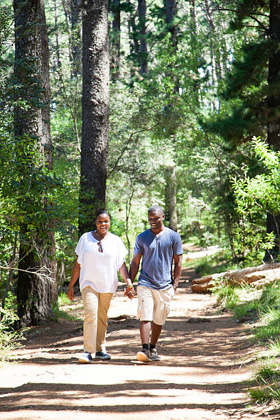 istock Happy African couple going for a walk in the forrest 515584237