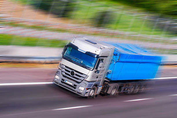 istock Gray-Blue Truck Running, motion  blur 515585085