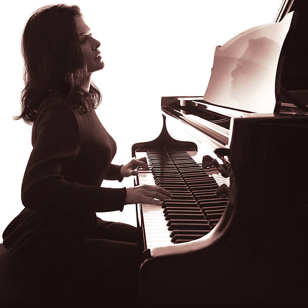 istock Pianist plays grand piano 515585147