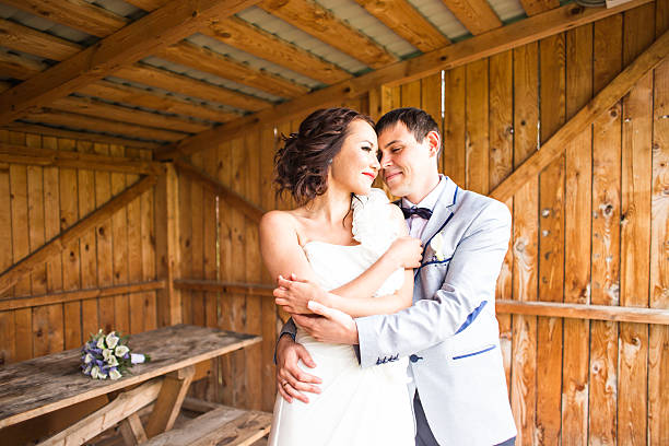 istock wedding pair hugging and kissing 515591772