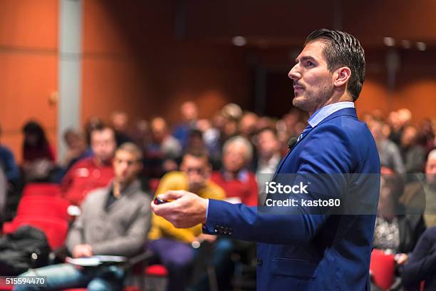 Public Speaker Giving Talk At Business Event Stock Photo - Download Image Now - Public Speaker, Speaker, Convention Center