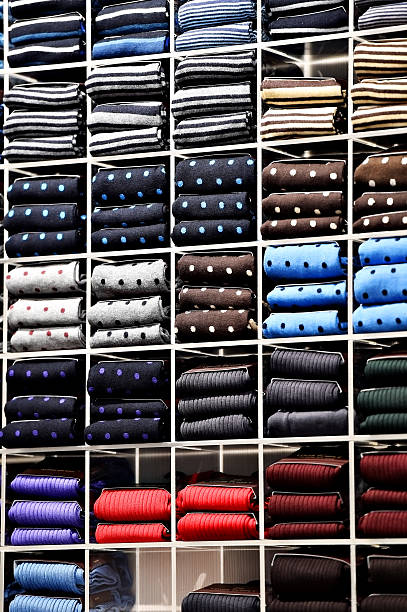 istock Elegant neckties on shelves in a store 515596688