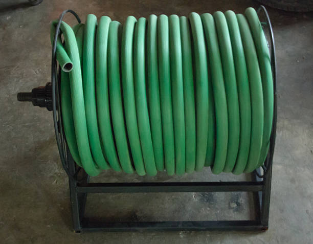 istock watering garden hose on the spool 515596988