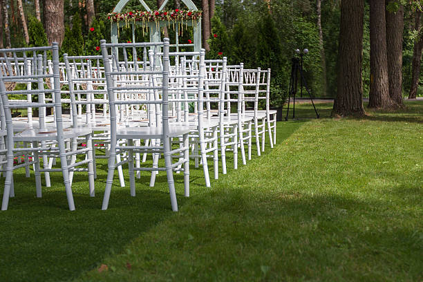 istock White wedding chairs on a green lawn, without decoration-2 515597648