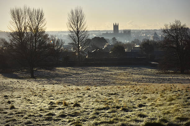 Canterbury on a frosty morning A cold winter dawn over the historic City of Canterbury with the ancient cathedral in semi silhouette canterbury england stock pictures, royalty-free photos & images