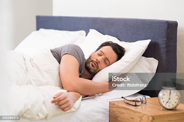 Young Man Sleeping Stok Fotoğraflar & Uyumak‘nin Daha Fazla Resimleri - Uyumak, Adamlar, Yastık - Yatak Takımı