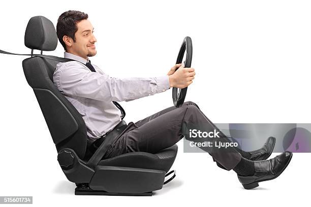 Man Driving Seated On A Car Seat Stock Photo - Download Image Now - Driving, Car, Men