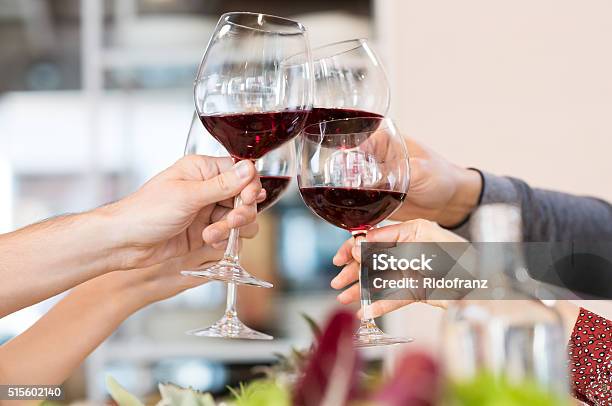 Toasting Glasses Stock Photo - Download Image Now - Celebratory Toast, Wine, Red Wine