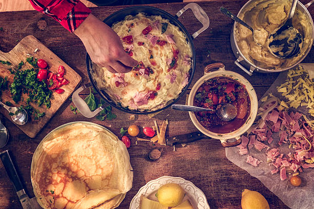 istock Preparing Baked Crepes Pancakes with Ham and Tomatoes 515603496
