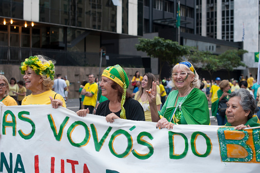 São Paulo, Brazil, March, 13, 2016: Ladies of a political group of right holding a bannerAbout 2 million demonstrators on Paulista Avenue calling for an end to corruption in Brazilian politics and punishment of politicians and businessmen involved misuse of public money