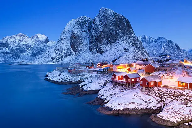 Photo of Norwegian fisherman's cabins on the Lofoten at dawn in winter