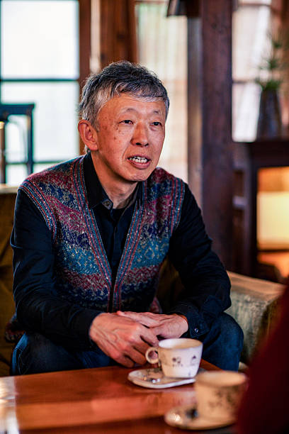 istock Senior man sitting in a cafe with a comfortable atmosphere 515604724