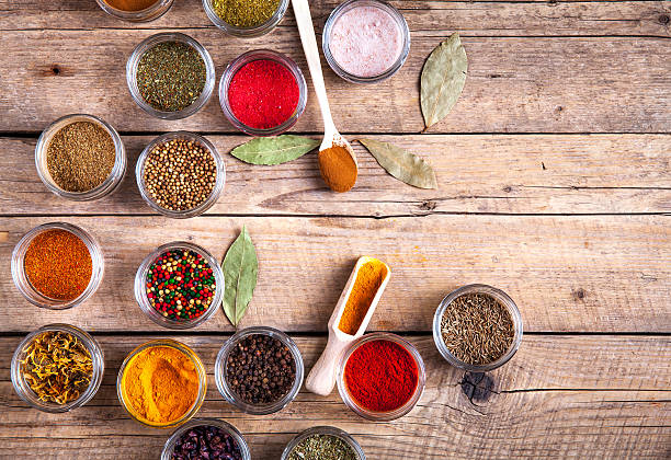 istock Spices in jars on wooden background. Food 515606578