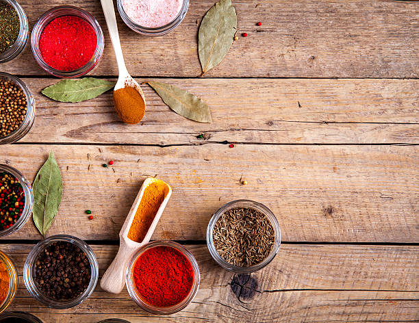 istock Spices in jars on wooden background. Food 515607084