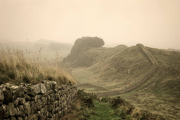 A winter sunrise landscape vignette during a temperature inversion at The Roaches in the Peak District National Park, England, UK.